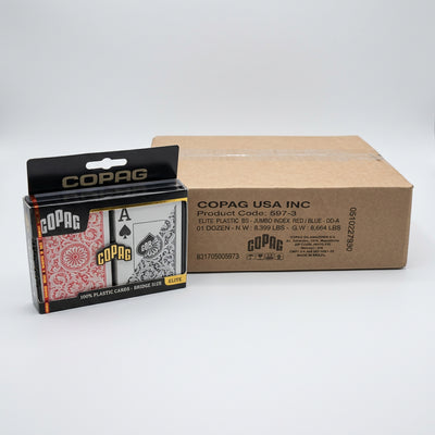 A Copag playing card deck in its retail packaging, shown alongside a large brown cardboard shipping box printed with Copag USA Inc details.
